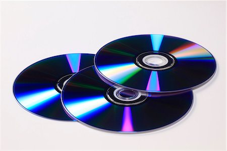 dvd silhouette - DVD discs Foto de stock - Sin royalties Premium, Código: 622-06397908