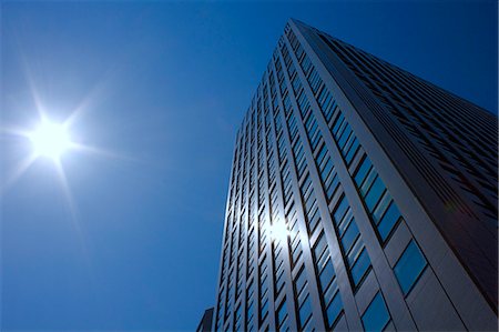 financial district in asia - Sun reflecting on office building windows Stock Photo - Premium Royalty-Free, Code: 622-06439264