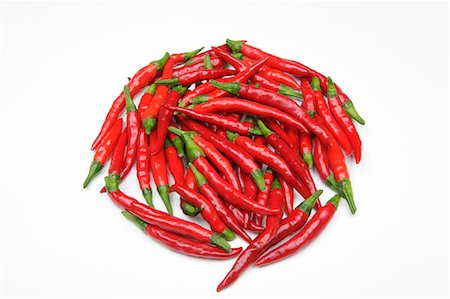 Chilly peppers against white background Stock Photo - Premium Royalty-Free, Code: 622-06439841