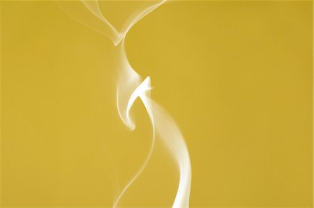 White smoke on yellow background Stock Photo - Premium Royalty-Free, Code: 622-06486706