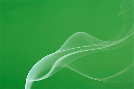 flowing - White smoke on green background Stock Photo - Premium Royalty-Free, Code: 622-06486782
