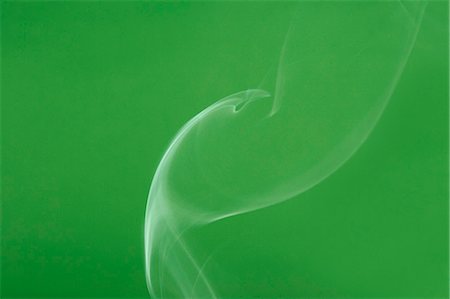 flowing - White smoke on green background Stock Photo - Premium Royalty-Free, Code: 622-06486783