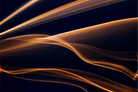 swirls - Orange smoke on black background Stock Photo - Premium Royalty-Free, Code: 622-06548887