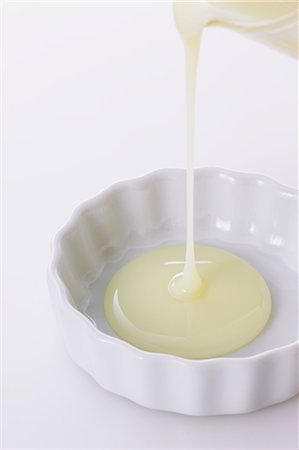 dripping silhouette - Condensed milk Stock Photo - Premium Royalty-Free, Code: 622-07743597