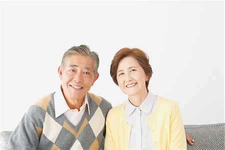 people lining up on white background - Japanese senior couple on the sofa Stock Photo - Premium Royalty-Free, Code: 622-08122667
