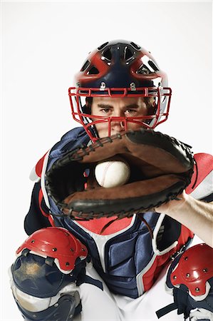 protector - Baseball catcher against white background Stock Photo - Premium Royalty-Free, Code: 622-08123145