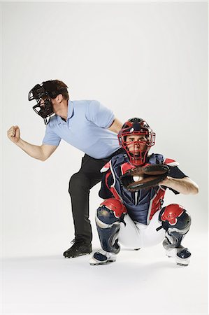 spike - Baseball catcher and chief referee against white background Stock Photo - Premium Royalty-Free, Code: 622-08123148