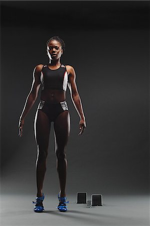 sprinter - African Female Athlete Exercising, Studio Shot Stock Photo - Premium Royalty-Free, Code: 622-08123296