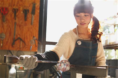Young Japanese woman enjoying glass crafting workshop in Kawagoe, Japan Stock Photo - Premium Royalty-Free, Code: 622-08123459