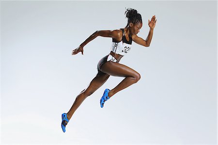 female sprinter - Female Athlete Running Stock Photo - Premium Royalty-Free, Code: 622-08123517