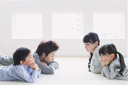 picture kid sad window - Young family laying on the floor Stock Photo - Premium Royalty-Free, Code: 622-08139010