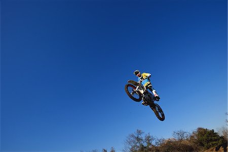 Motocross biker on dirt track Stock Photo - Premium Royalty-Free, Code: 622-08355495