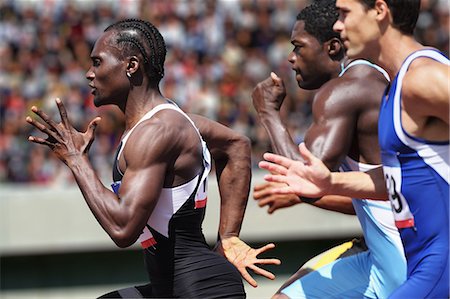 simsearch:858-06617630,k - Athletes running on running track Stock Photo - Premium Royalty-Free, Code: 622-08355517