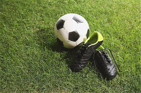 spike - Soccer ball and shoes on grass Stock Photo - Premium Royalty-Free, Code: 622-08355550