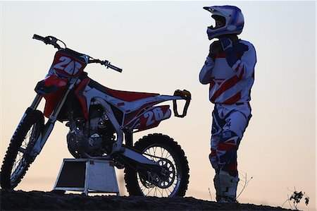 Motocross biker on dirt track Stock Photo - Premium Royalty-Free, Code: 622-08355576