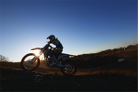 Motocross biker on dirt track Stock Photo - Premium Royalty-Free, Code: 622-08355591