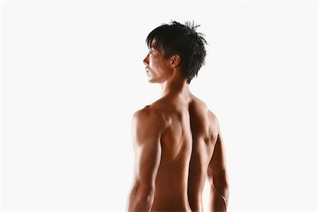 Japanese male athlete showing off muscles Stock Photo - Premium Royalty-Free, Code: 622-08355758