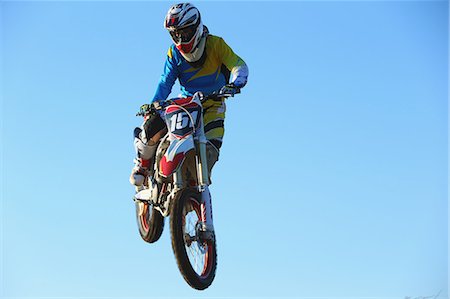 simsearch:622-08519684,k - Motocross biker jumping over dirt track Stock Photo - Premium Royalty-Free, Code: 622-08355827