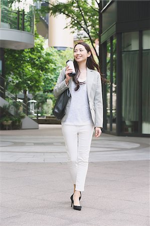 Japanese attractive businesswoman in downtown Tokyo Stock Photo - Premium Royalty-Free, Code: 622-08482404