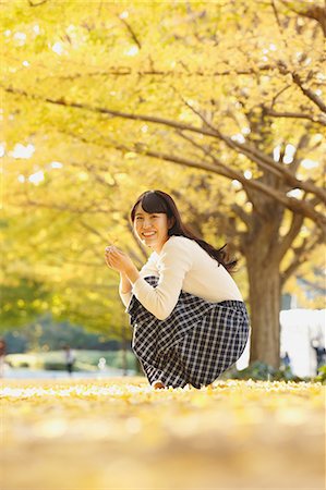 Young Japanese woman in a city park Stock Photo - Premium Royalty-Free, Code: 622-08542968