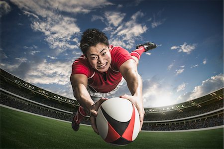 diving (not water) - Portrait of Japanese rugby player diving to score a try Stock Photo - Premium Royalty-Free, Code: 622-08657626