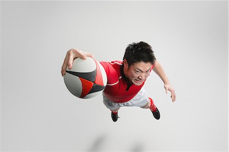 diving (not water) - Portrait of Japanese rugby player diving to score a try Stock Photo - Premium Royalty-Free, Code: 622-08657738