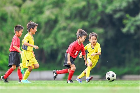 players in action for goal - Japanese kids playing soccer Stock Photo - Premium Royalty-Free, Code: 622-08893933