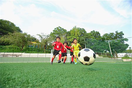 players in action for goal - Japanese kids playing soccer Stock Photo - Premium Royalty-Free, Code: 622-08893954