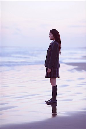 Young Japanese woman in a high school uniform by the sea, Chiba, Japan Stock Photo - Premium Royalty-Free, Code: 622-08949183