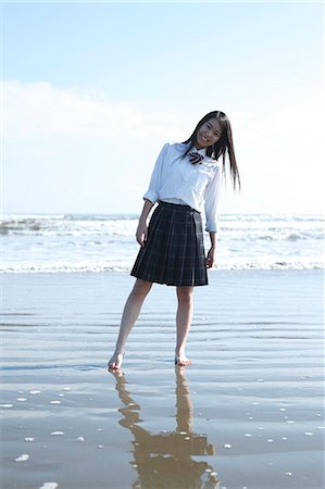 Young Japanese woman in a high school uniform by the sea, Chiba, Japan Stock Photo - Premium Royalty-Free, Code: 622-08949315