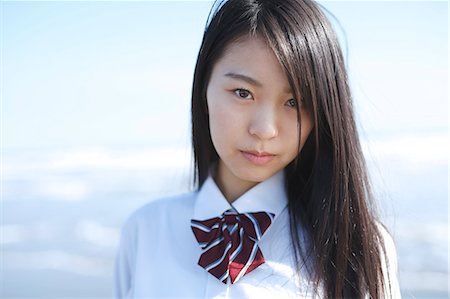 Young Japanese woman in a high school uniform by the sea, Chiba, Japan Foto de stock - Sin royalties Premium, Código: 622-08949320