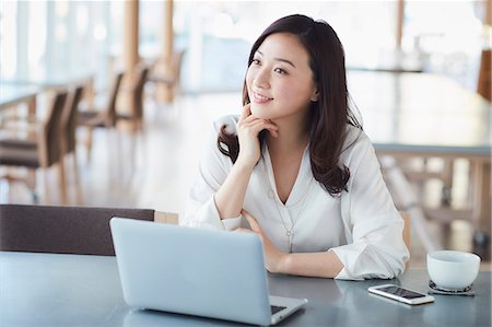 simsearch:6109-08690411,k - Japanese woman with laptop in a stylish cafe Stock Photo - Premium Royalty-Free, Code: 622-09014329