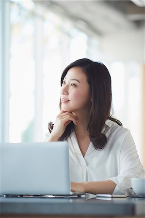 simsearch:6109-08690411,k - Japanese woman with laptop in a stylish cafe Stock Photo - Premium Royalty-Free, Code: 622-09014320