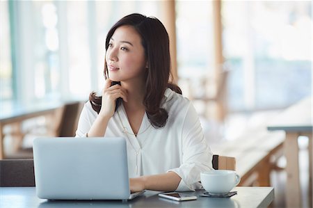 simsearch:6109-08690411,k - Japanese woman with laptop in a stylish cafe Stock Photo - Premium Royalty-Free, Code: 622-09014321