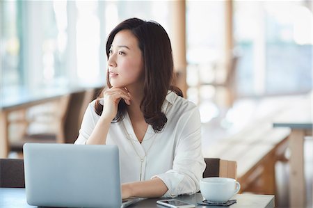 simsearch:6109-08690411,k - Japanese woman with laptop in a stylish cafe Stock Photo - Premium Royalty-Free, Code: 622-09014322