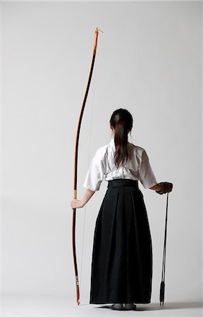 Japanese traditional archery athlete against white background Stock Photo - Premium Royalty-Free, Code: 622-09014514