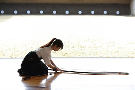 Japanese traditional archery athlete practicing Stock Photo - Premium Royalty-Free, Code: 622-09014527