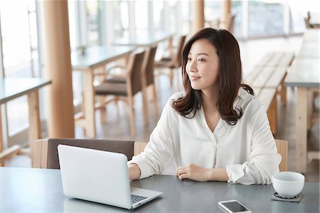 simsearch:6109-08690411,k - Japanese woman with laptop in a stylish cafe Stock Photo - Premium Royalty-Free, Code: 622-09014696