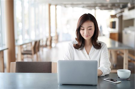 simsearch:6109-08690411,k - Japanese woman with laptop in a stylish cafe Stock Photo - Premium Royalty-Free, Code: 622-09014771