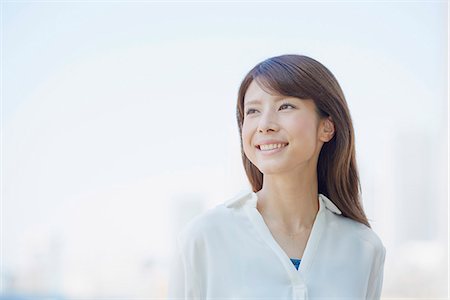 Portrait of young Japanese woman downtown Tokyo, Japan Stock Photo - Premium Royalty-Free, Code: 622-09013979