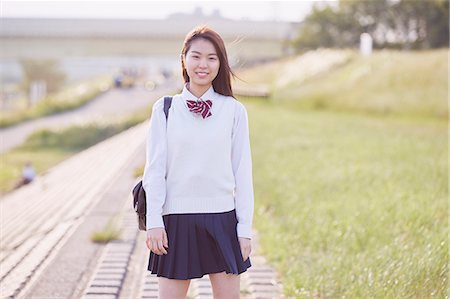 riverside - Cute Japanese high school student in a city park Stock Photo - Premium Royalty-Free, Code: 622-09138624