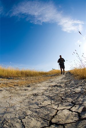 Male hiker on track Stock Photo - Premium Royalty-Free, Code: 622-01080637