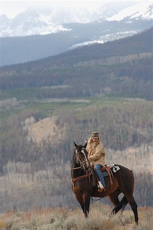 ride horse in the snow - Cowgirl in the Countryside Stock Photo - Premium Royalty-Free, Code: 622-01572170