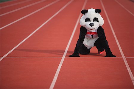 Panda Crouching on a Track Stock Photo - Premium Royalty-Free, Code: 622-01572253