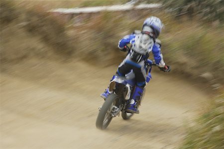 Dirtbiking over Mounds Stock Photo - Premium Royalty-Free, Code: 622-01956290