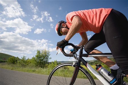 racer - Road cyclist in action, side view Stock Photo - Premium Royalty-Free, Code: 622-02198537