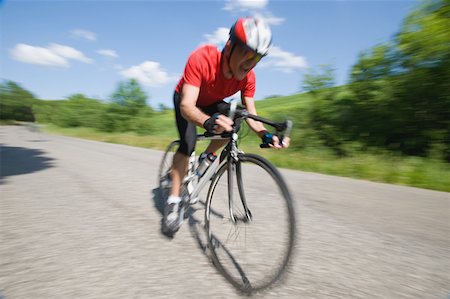 Cyclist cycling on road, blurred, motion Stock Photo - Premium Royalty-Free, Code: 622-02198555
