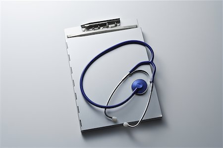 still life of stethoscope - Studio shot of clipboard with stethoscope Stock Photo - Premium Royalty-Free, Code: 622-02354362