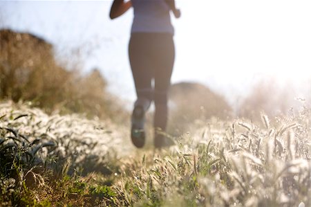 Person jogging in countryside Stock Photo - Premium Royalty-Free, Code: 622-02621563