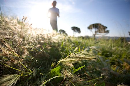 Girl jogging in countryside Stock Photo - Premium Royalty-Free, Code: 622-02621571